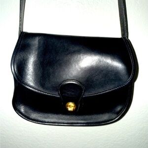 Vintage black coach leather saddle bag.